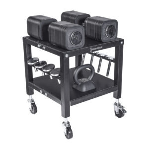 The Ironmaster QLDB Stand PRO, a black multi-level rolling cart, holds four Ironmaster adjustable dumbbells on top, a kettlebell on the second shelf, and several accessories on side hooks. Its equipped with wheels for easy movement.