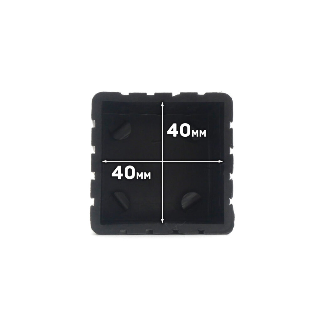 The Rubber Foot 40mmx40mm is a black, square object with dimensions of 40 mm by 40 mm. It has a grooved outer edge and a plain inner surface.