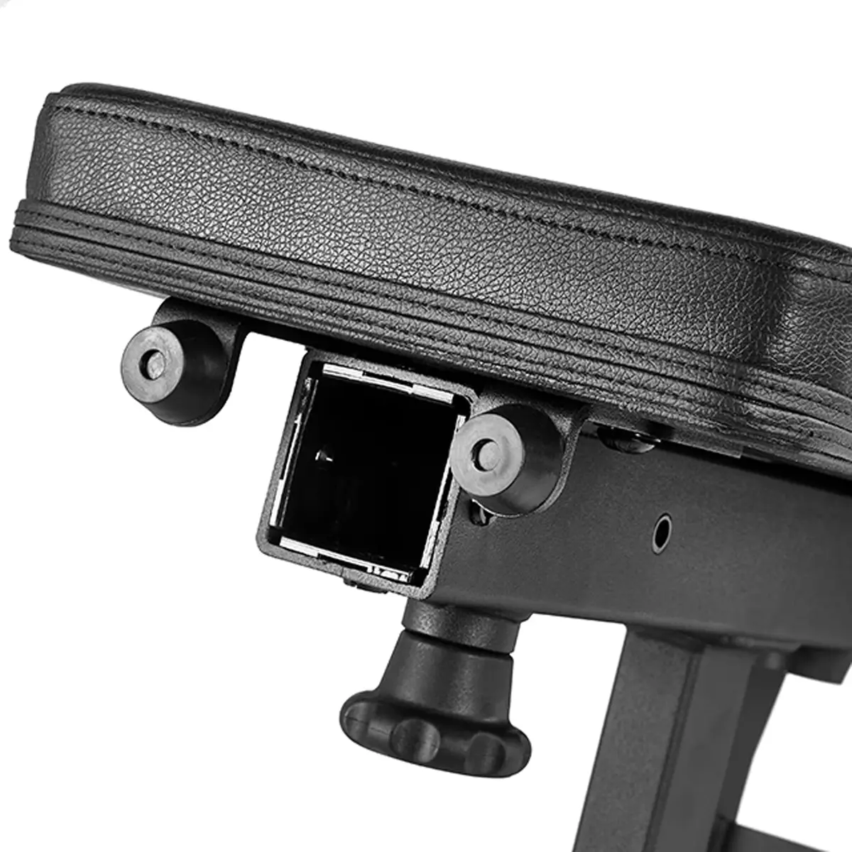 A close-up of the ATX® Warrior Bench 2.0 shows a black adjustable armrest with visible screws and a square attachment on the underside, featuring a textured cushion and height-adjustment knob.