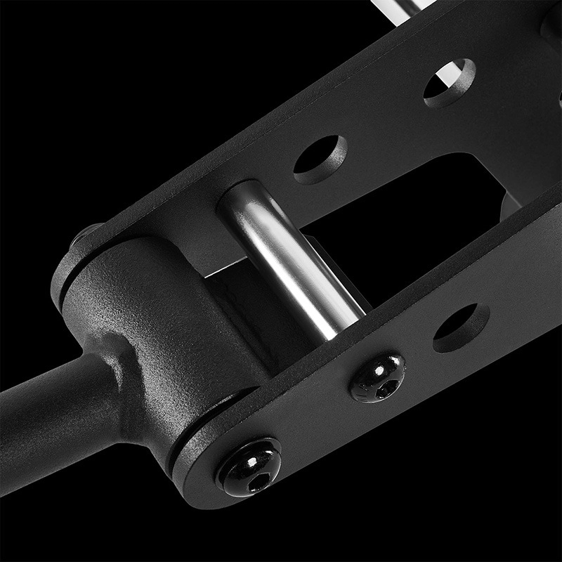 Close-up of a black metal hinge mechanism with bolts and a cylindrical pin from the ATX® Pec-Fly Attachment, set against a solid black background.