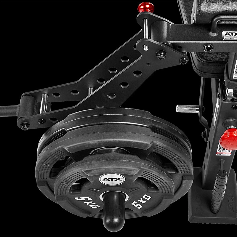 Close-up of a black gym machine with an adjustable metal arm and ATX® Pec-Fly Attachment, loaded with two 5 kg ATX weight plates, featuring red locking pins and a handle attachment, all set against a black background.
