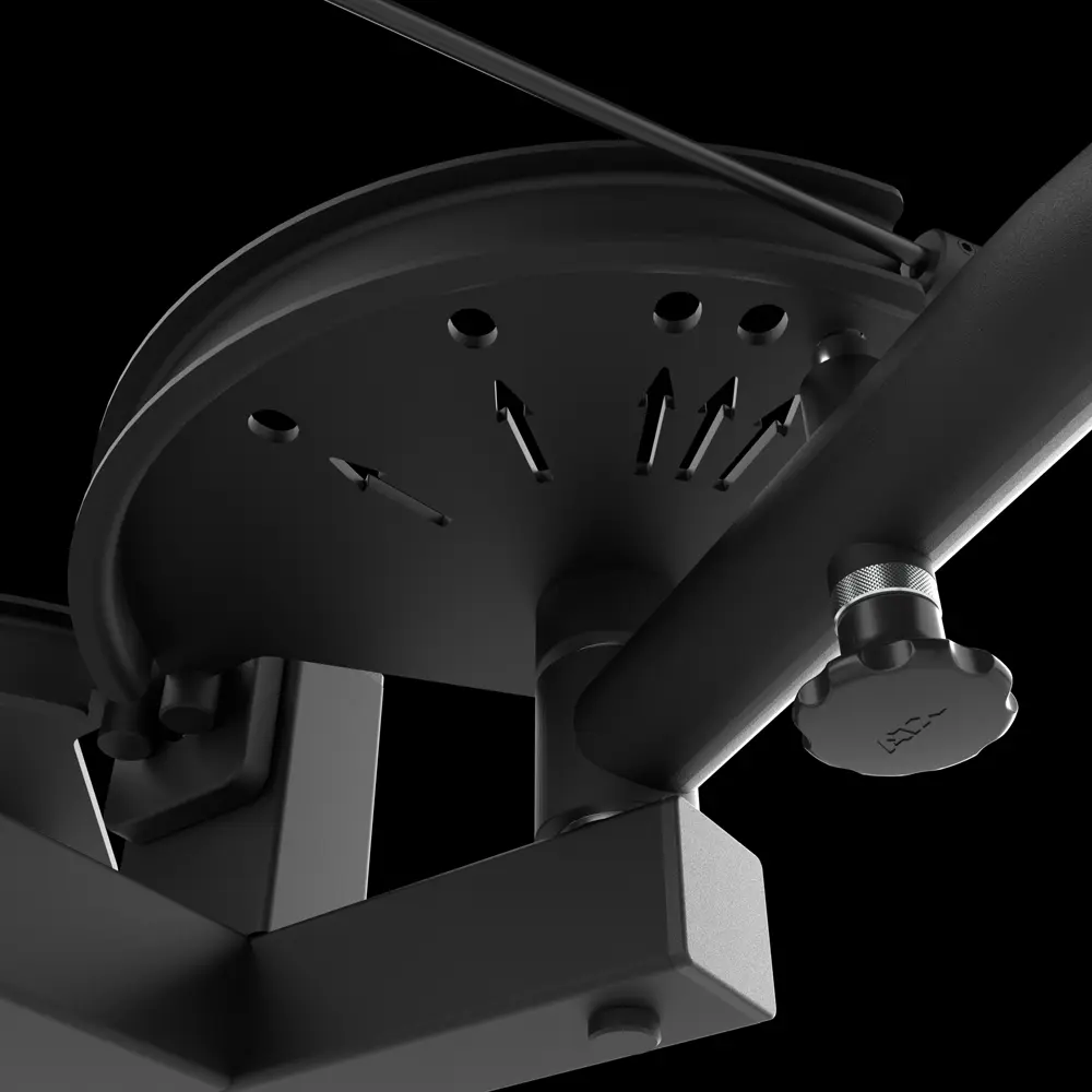 Close-up view of a black metal mechanism featuring a circular plate, adjustment knob, and arrows indicating various position settings against a black background, as found on the ATX® Pec Fly/Rear Delt Machine.