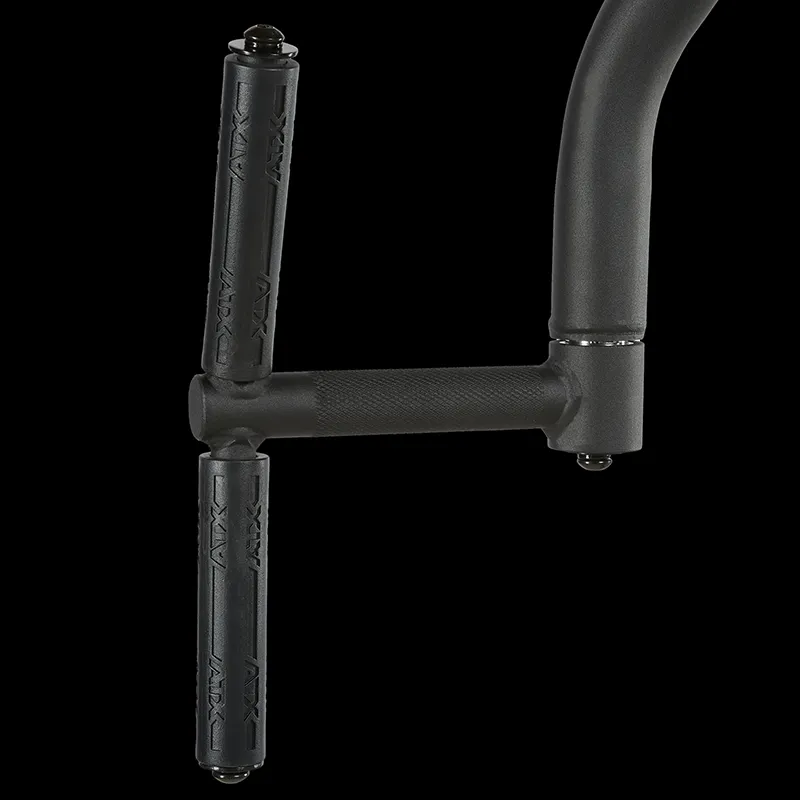 Close-up of the ATX® Pec Fly/Rear Delt Machine's black metal handlebar attachment, with two vertical textured rubber grips and a curved horizontal bar, shown against a solid black background.