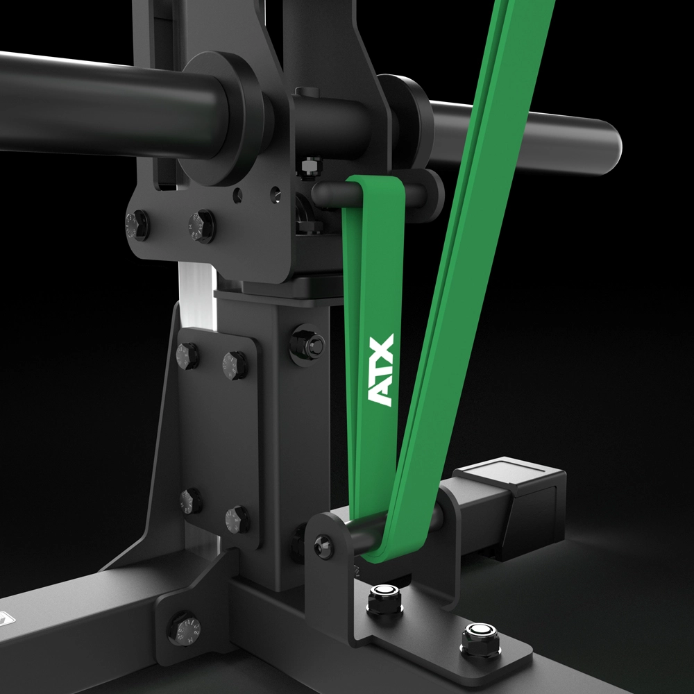 Close-up of an ATX® Pec Fly/Rear Delt Machine with a green ATX resistance band attached to metal bolts, set against a black background.