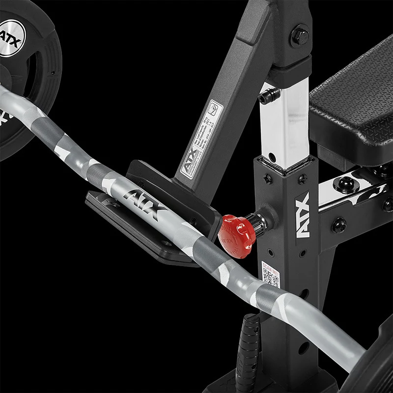 An EZ-curl bar resting in the cradle of an ATX Bicep Curl Pad attachment.