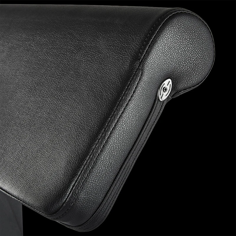 Close-up of the black padded ATX Bicep Curl Pad with a rounded edge and a metal bolt on the side.