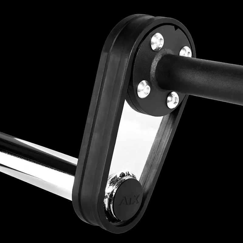 Close-up of an ATX® Safety Squat Bar - 50mm showing a black and silver mechanical component with a cylindrical rod, triangular frame, bolts, and a circular piece marked "AIX" against a solid black background.