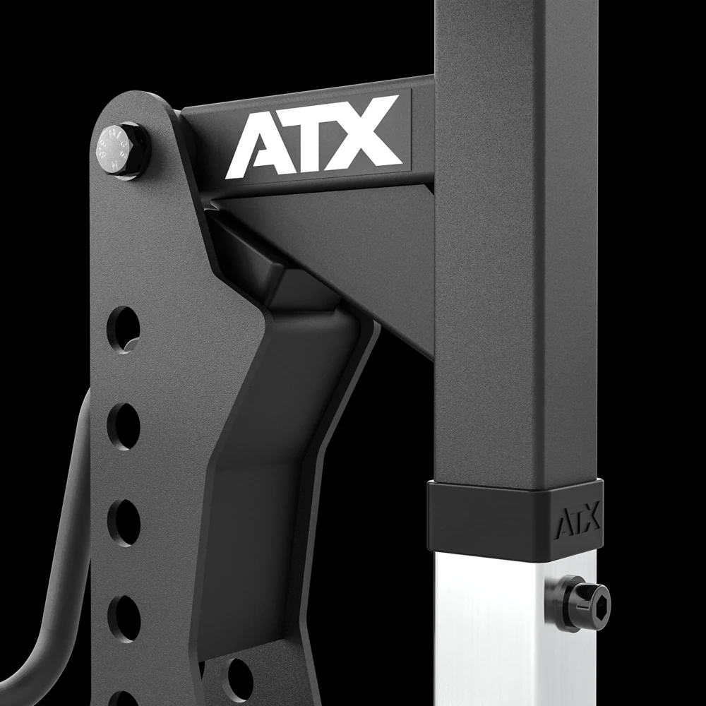 Close-up of the ATX Biceps Curl Attachment hinge plate with ATX logo and the chrome height adjustment upright with locking pin