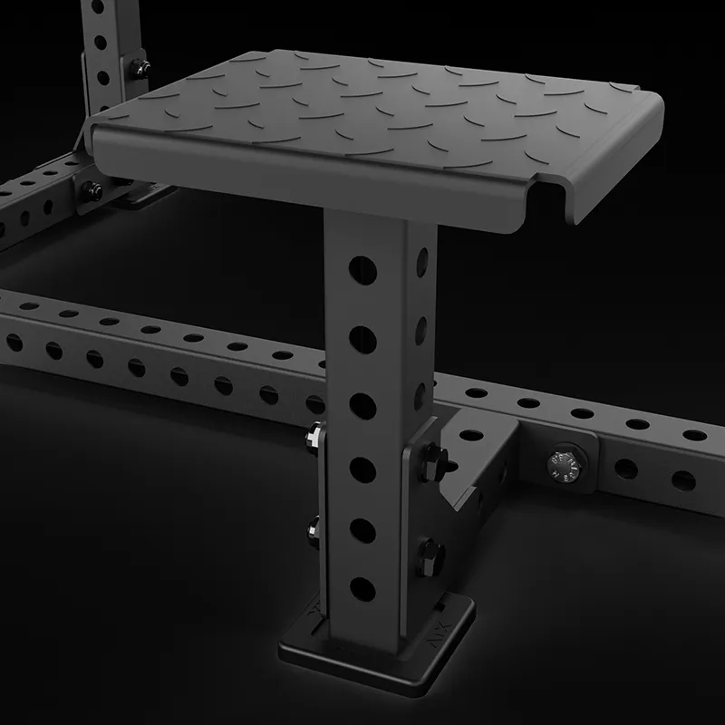 A close-up of the ATX® Seal Row Bench shows its sturdy, adjustable steel platform with a textured, non-slip surface attached to a gym rack featuring multiple height adjustment holes against a dark background.