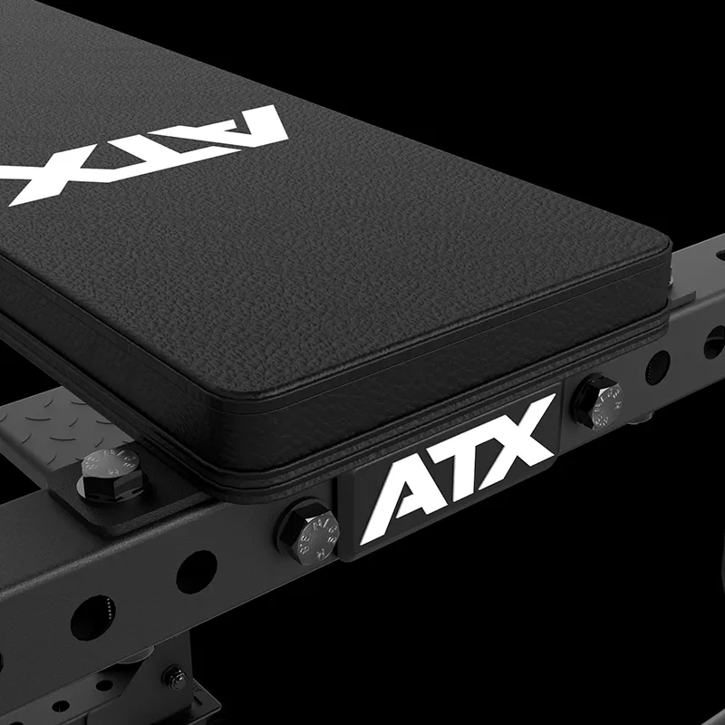 Close-up of the ATX® Seal Row Bench, a black padded workout bench with ATX logos on the surface and frame, featuring adjustable knobs and sturdy metal construction.