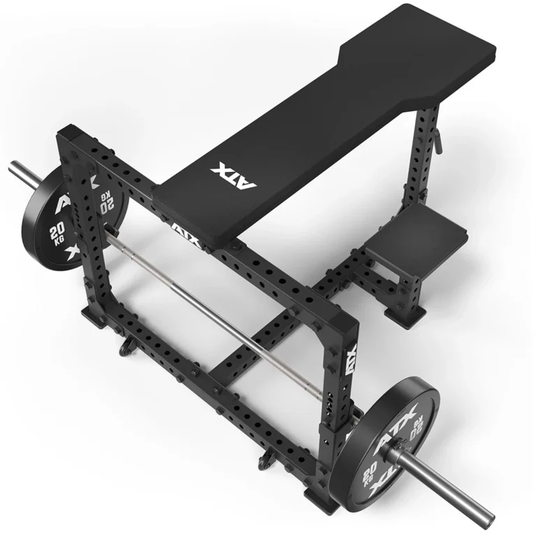 A gym bench press setup with a sleek black ATX® Seal Row Bench, featuring a sturdy barbell and 20 kg weight plates on the rack, offers durable and stylish metal construction.