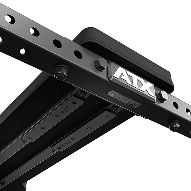 The ATX® Seal Row Bench features a close-up of a black metal frame with the ATX logo, multiple holes for adjustable settings, two parallel bars for stability, and a padded top piece.