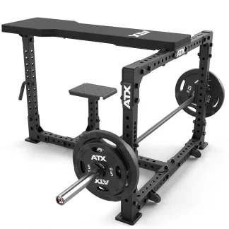 The ATX® Seal Row Bench is a black powerlifting station with an adjustable bench, safety bars, and sturdy metal frame featuring multiple adjustment holes. Two 15 kg weight plates are loaded on each end of the barbell.