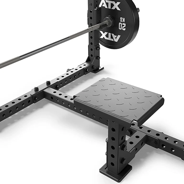 The ATX® Seal Row Bench features a heavy-duty, adjustable squat rack in black with perforated metal design, supporting intense workouts. It also includes a barbell loaded with 50 kg weights on each side.