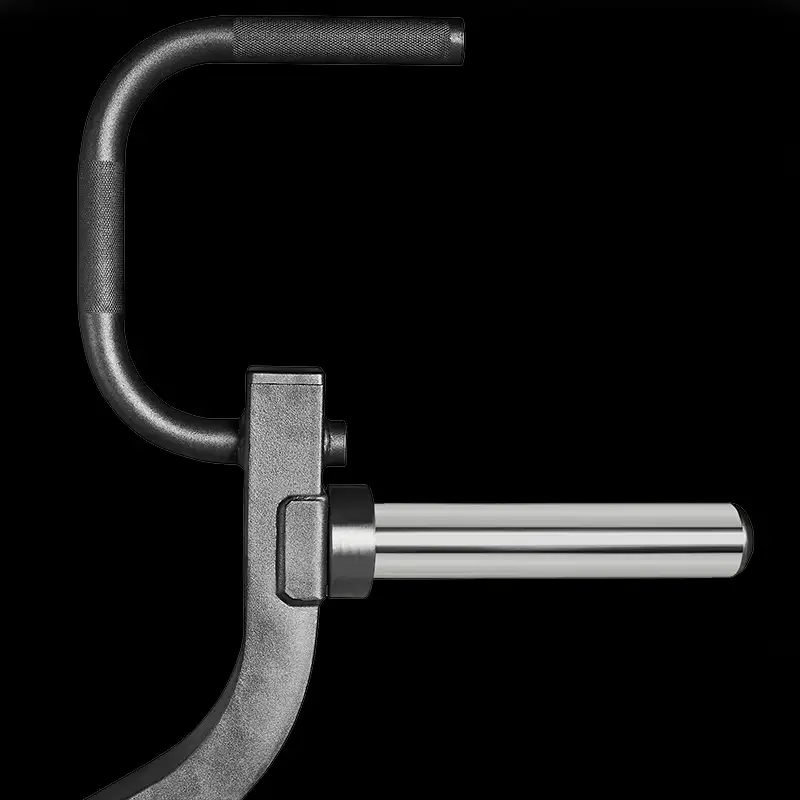 Close-up of the metallic L-shaped handle on the sturdy black frame of the ATX® Triplex Weight Stack Gym, featuring a cylindrical silver rod extending horizontally, all set against a solid black background.