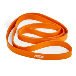 A textured orange ATX® Latex Free Resistance Band - 9 Levels, coiled in a loose loop to display its flexibility and length, making it perfect for training sessions.