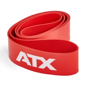 A red ATX® Latex Free Resistance Band - 9 Levels, featuring a textured surface, is coiled neatly. The letters ATX are prominently printed in white on the side of this gym resistance band, which sits against a plain white background, ready for your training sessions.
