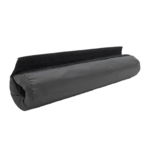 A product named the "Barbell Pad Nylon Cover" resembles a cylindrical draft stopper with a black fabric exterior, featuring a velcro strip on top to effectively block drafts under doors. It's designed to roll up neatly and offers a smooth, textured surface.