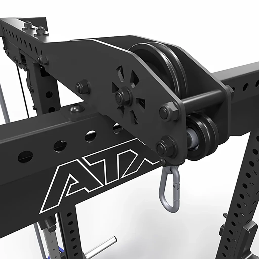 A close-up of the ATX® Lat Option 780 Plate Loaded, a black pulley system attached to a fitness rack, features ATX branding. It includes a carabiner and multiple adjustment holes for advanced weightlifting or fitness routines.