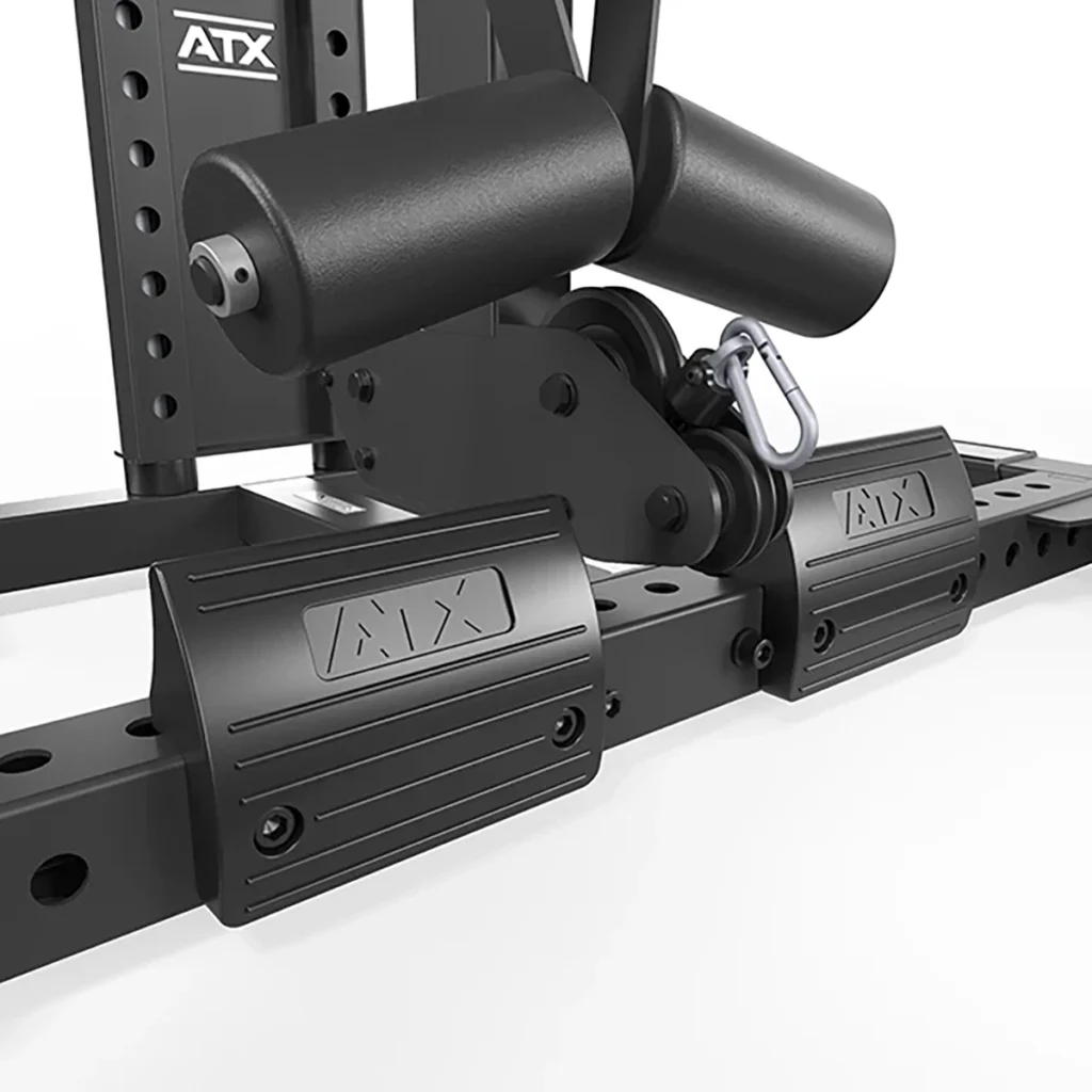 Close-up of the black ATX® Lat Option 780 Plate Loaded foot platform with padded rollers, featuring sturdy metal construction. It has adjustment holes and a locking mechanism, perfect for integration. Set against a bright white background.