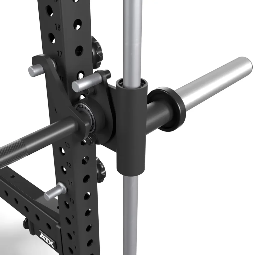 Close-up of the ATX® Smith Machine Bar Attachment - PRX-780 on a squat rack with a barbell and locking mechanism, mounted on a vertically slotted metal frame, perfect for weightlifting and strength training exercises.