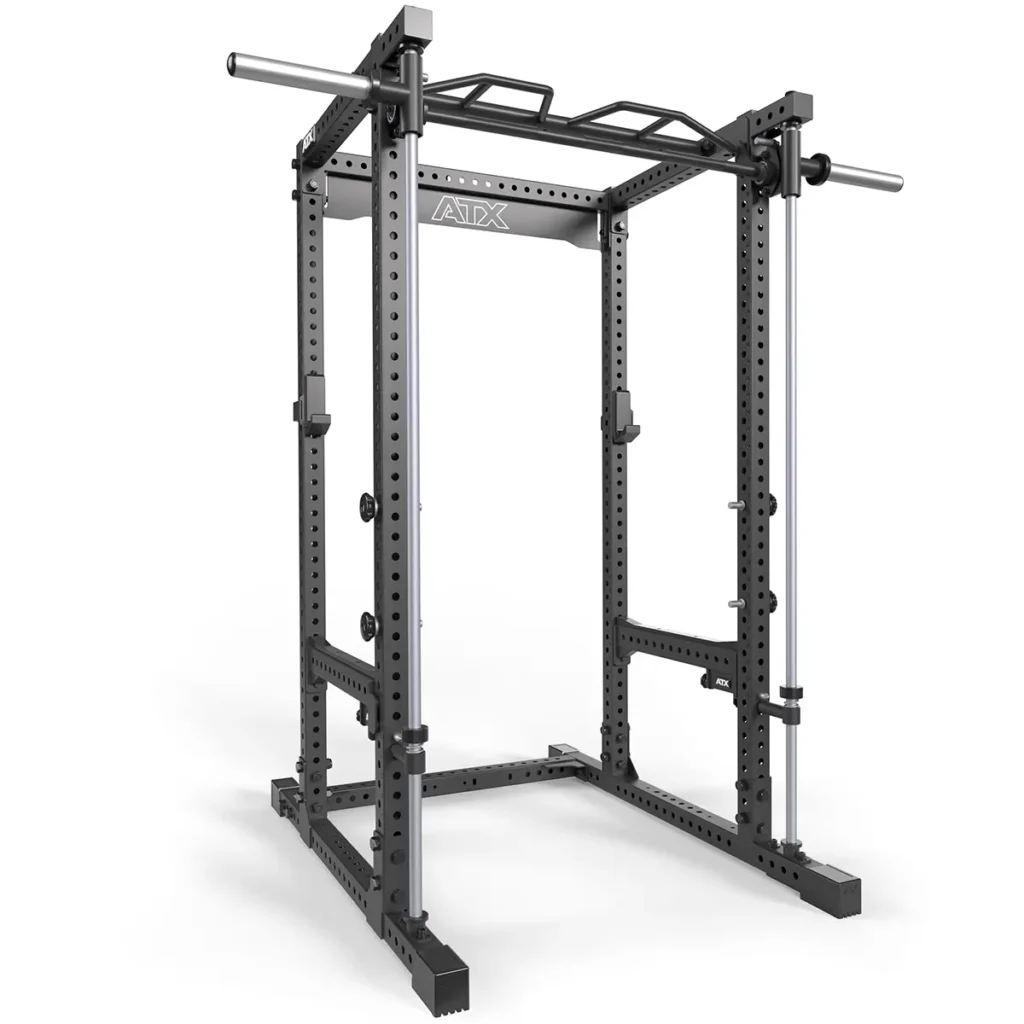 The ATX® PRX-780 is a black metal power rack with adjustable hooks, a pull-up bar, and safety bars for weightlifting. It includes a Smith Machine Bar Attachment and features a robust rectangular frame with visible holes for customization. ATX is printed on the horizontal beam.