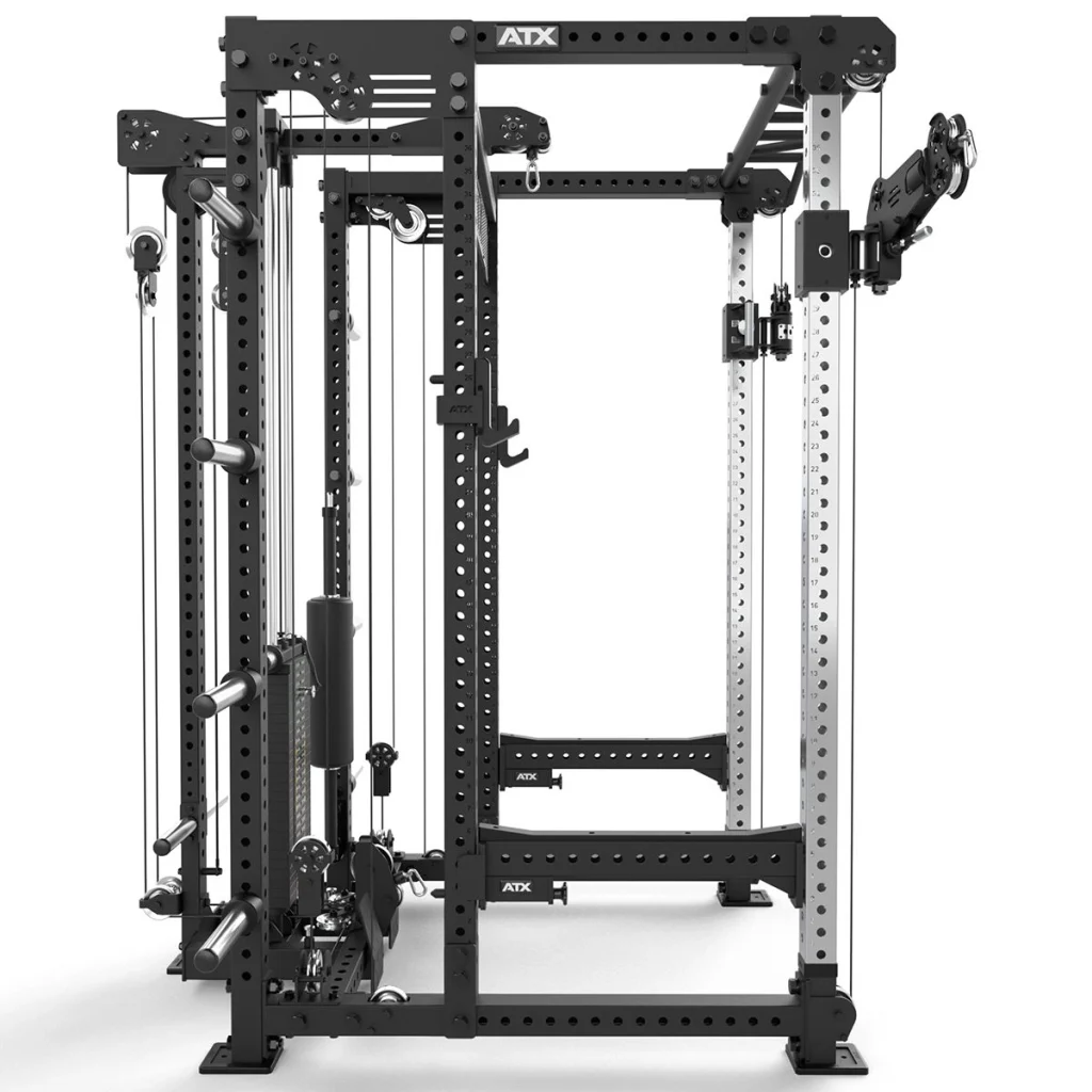 The ATX® Power Cage with Cables is a black and silver multifunctional gym machine featuring pulleys, weight plate holders, and adjustable bars for strength training. The “ATX” label appears on multiple parts of the cage.