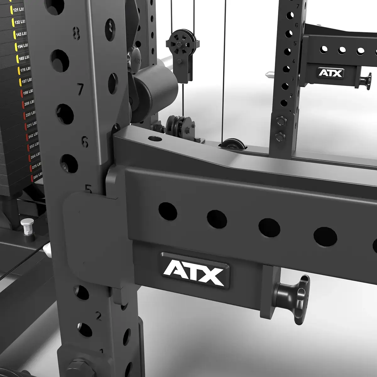 Close-up of a black ATX® Power Cage with Cables, showcasing its weight stack, adjustable cables, and sturdy design. Multiple holes allow precise adjustment of attachments height or position.