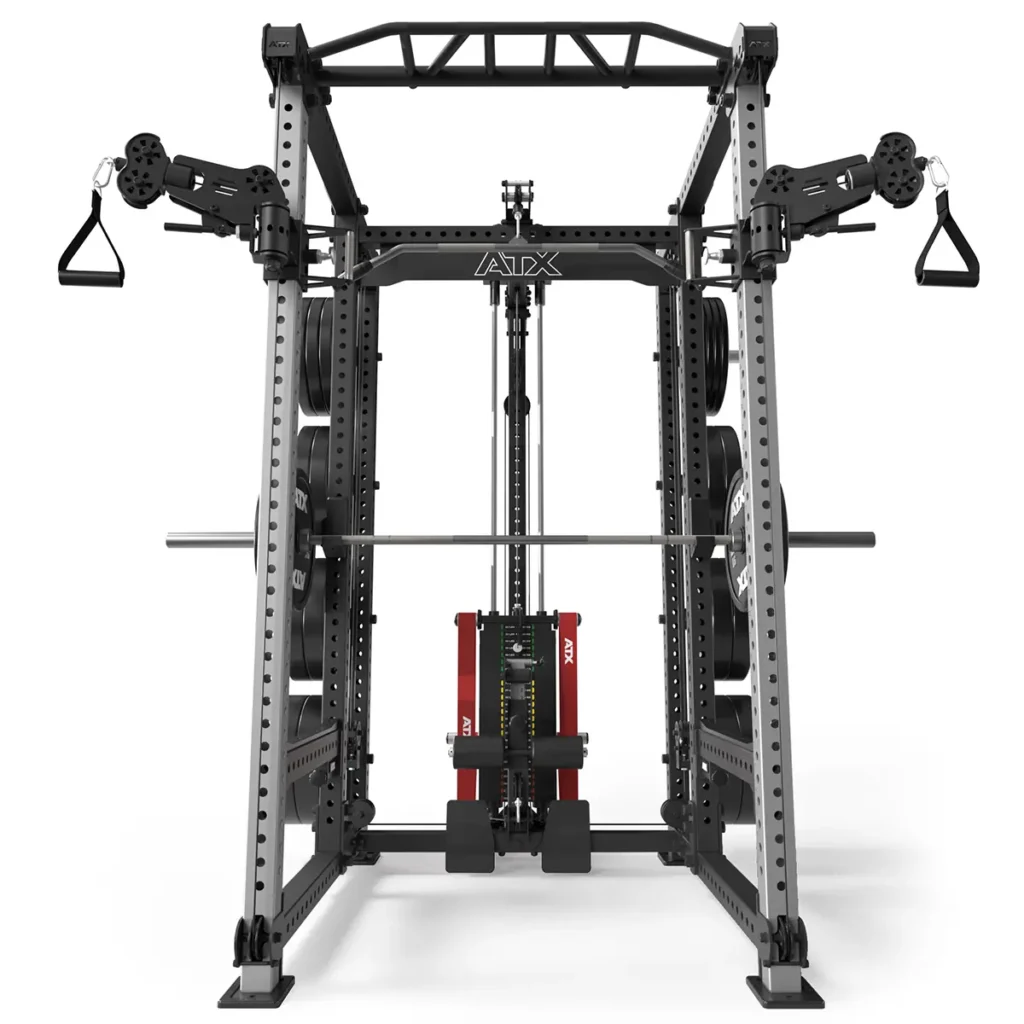The ATX® Power Cage with Cables is a professional multi-functional gym machine featuring a smith machine, cable pulleys, weight plates, pull-up bar, and various attachments for diverse workouts in a black and silver design.