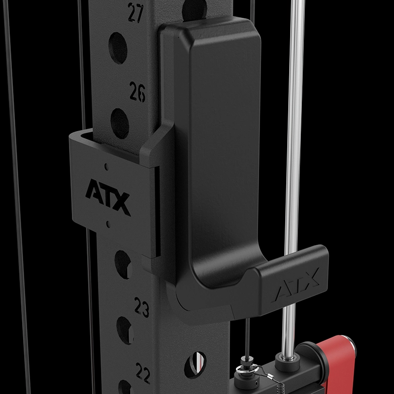 Close-up of a black ATX-branded hook attachment secured to the ATX® Power Cage with Cables, highlighting numbered adjustment holes, metal rods, and red components on the right against a black background.