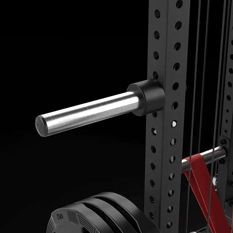 Close-up of a metal weight plate holder attached to the ATX® Power Cage with Cables, featuring multiple adjustment holes; weight plates and a red resistance band are visible at the base.