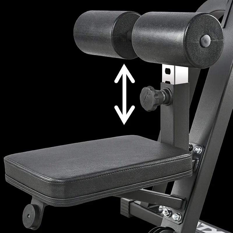 Close-up of a black leg support with two cylindrical pads above a padded seat, designed for the ATX® Cable Lat Pull Down Machine. A white double-headed arrow shows the upper pads' vertical adjustability.