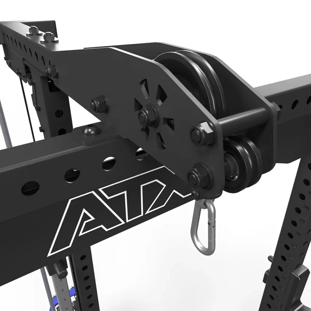 A close-up shows the ATX® Lat Option 780 125kg SW, a black metal pulley system with adjustable holes and a carabiner attachment for plate-loaded lat pulldown, mounted on a gym rack. The ATX logo is visible against a white background.