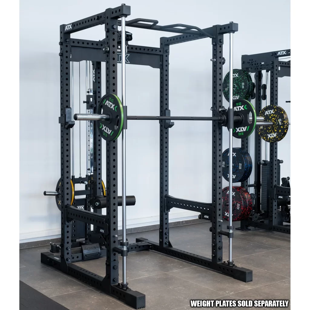The Commercial Power Rack 780, shown in black metal with a loaded barbell and weight plates, is set up in a gym with other barbells, racks, and weights in the background. Text at the bottom: WEIGHT PLATES SOLD SEPARATELY.