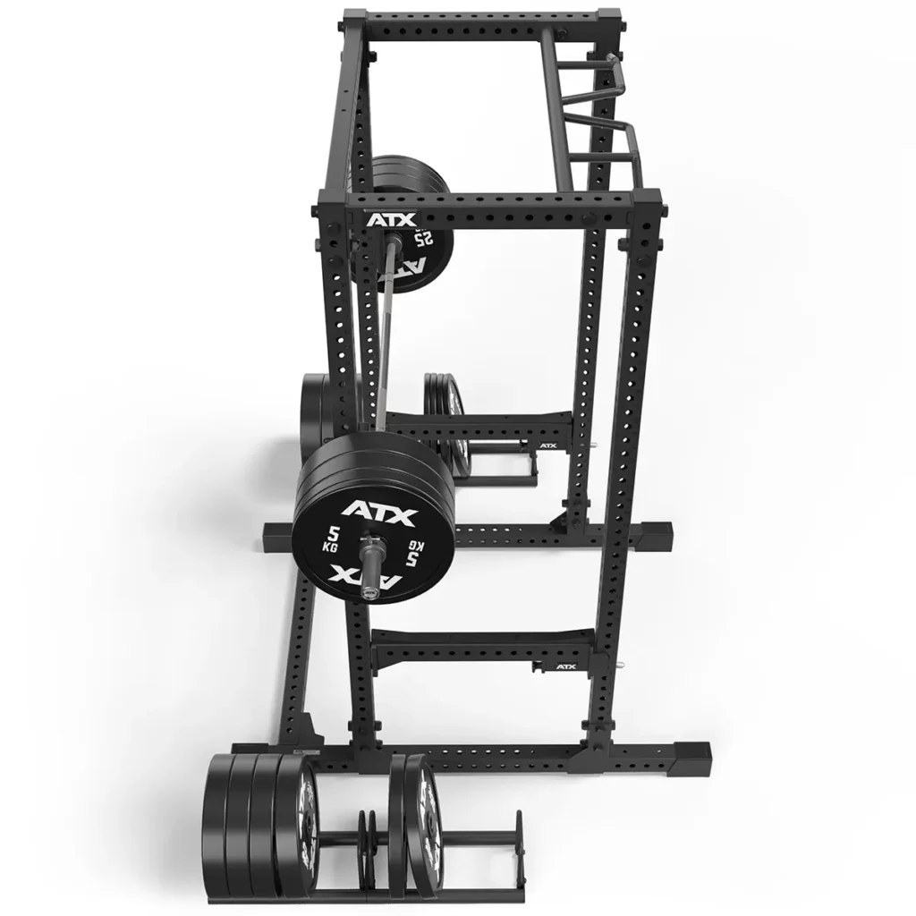 The ATX® Power Rack 780, a black power rack equipped with various weight plates and a pull-up bar, is displayed against a white background with the ATX brand visible on the weight plates.