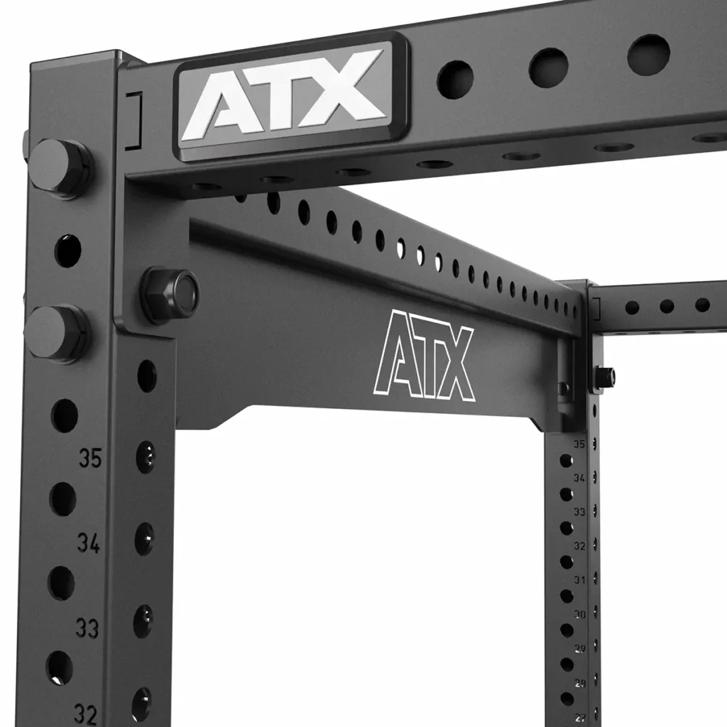 Close-up of the ATX® Power Rack 780, a black rack featuring adjustable holes and durability. Ideal for strength training exercises.