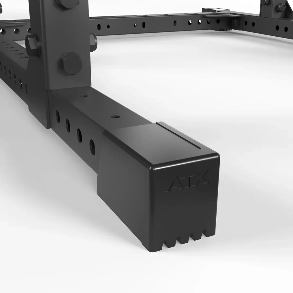 Close-up of an ATX® Power Rack 780, featuring a sturdy black metal frame with a rectangular base with drilled holes and embossed ATX protective cap. The plain white background highlights its design.