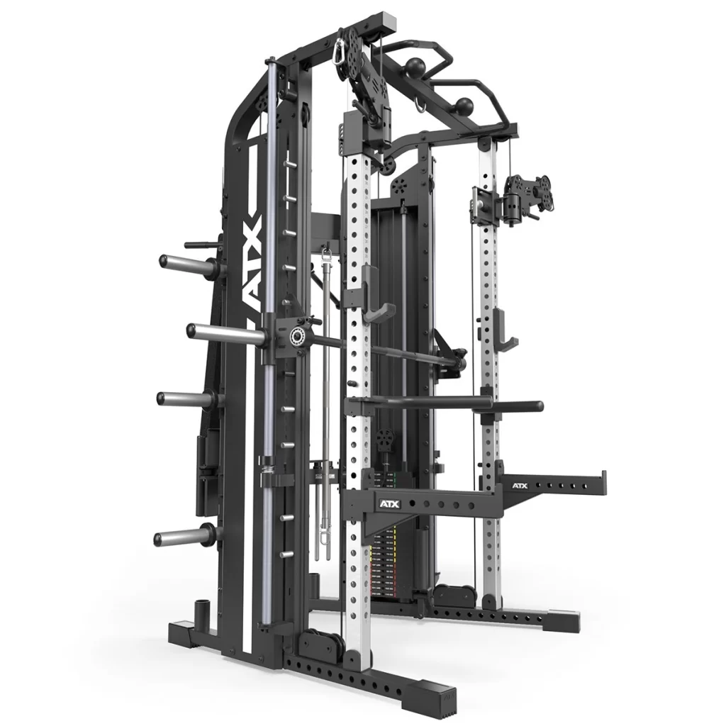 The ATX® Monster 2.0 All In One Trainer is a multifunctional weight training machine with a rack, adjustable pulleys, barbell supports, and weight plate holders for exercises like squats, bench presses, and cable workouts.