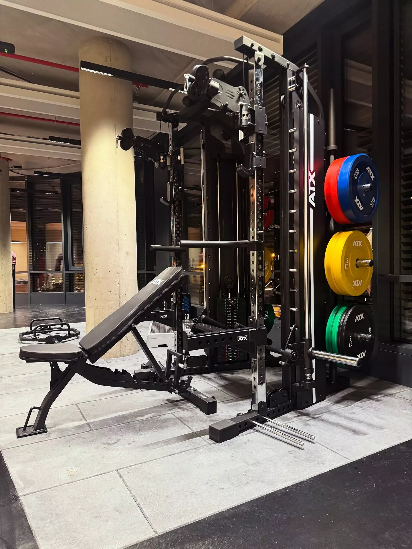 The ATX® Monster 2.0 All In One Trainer stands in the room, providing a complete gym equipment solution for any workout routine.