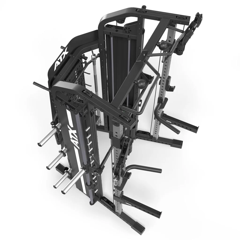 The ATX® Monster 2.0 All In One Trainer is a multifunctional gym station with a black frame, featuring pull-up bars, dip handles, and weight rack areas. It includes various attachments and bars for comprehensive weight training.