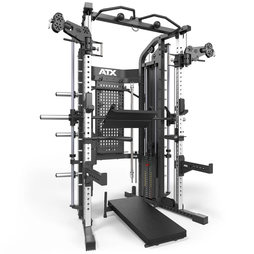 The image presents the ATX® Monster 2.0 All In One Trainer, a multifunctional gym rack with pulleys, weight storage, adjustable benches, and attachments for strength training. Its sturdy industrial design features a metallic finish showcasing the ATX brand name prominently.