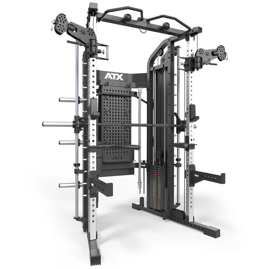 The ATX® Monster 2.0 All In One Trainer is a multifunctional gym machine featuring a power rack, cable pulleys, weight plate storage, adjustable bar hooks, and various attachments for versatile strength training. It boasts a sleek black and silver design.