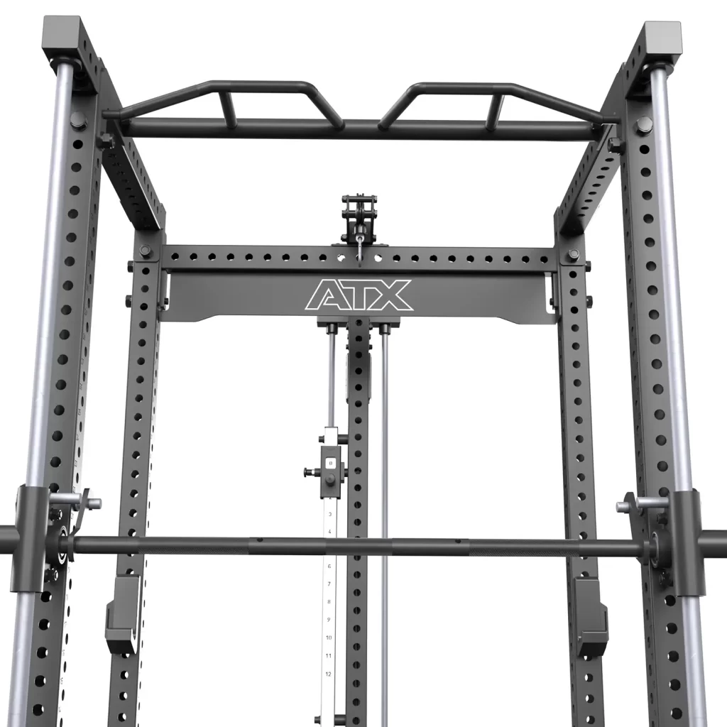 The ATX® Power Rack with Smith & Pulley System is a sturdy black rack featuring multiple grip pull-up bars, adjustable safety bars, an attached barbell, and a perforated frame proudly displaying the ATX logo at the top.