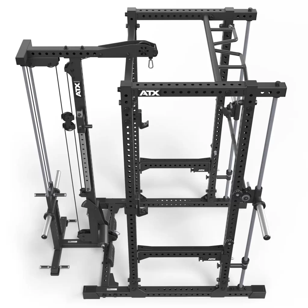 The ATX® Power Rack with Smith & Pulley System is a black power rack featuring adjustable cables, an integrated smith and pulley system, pull-up bar attachments, weight holders, and safety pins for strength training and versatile workouts.