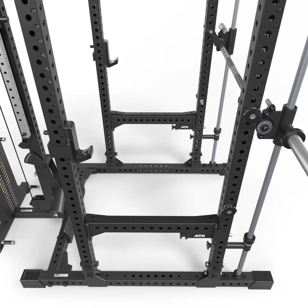 The ATX® Power Cage with Smith & Lat Pulldown is a black, versatile weightlifting unit viewed from above, featuring multiple hooks and adjustable bars. It includes a side cable system and an array of customization holes, with the ATX brand prominently displayed.