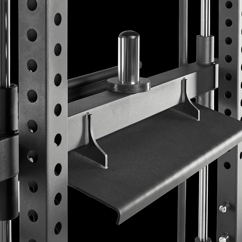 Close-up of the ATX® Vertical Leg Press attachment on a power rack, showing its black metal build with circular holes, vertical rods, and an angled tray—ideal for organizing gym accessories or supporting leg press workouts.