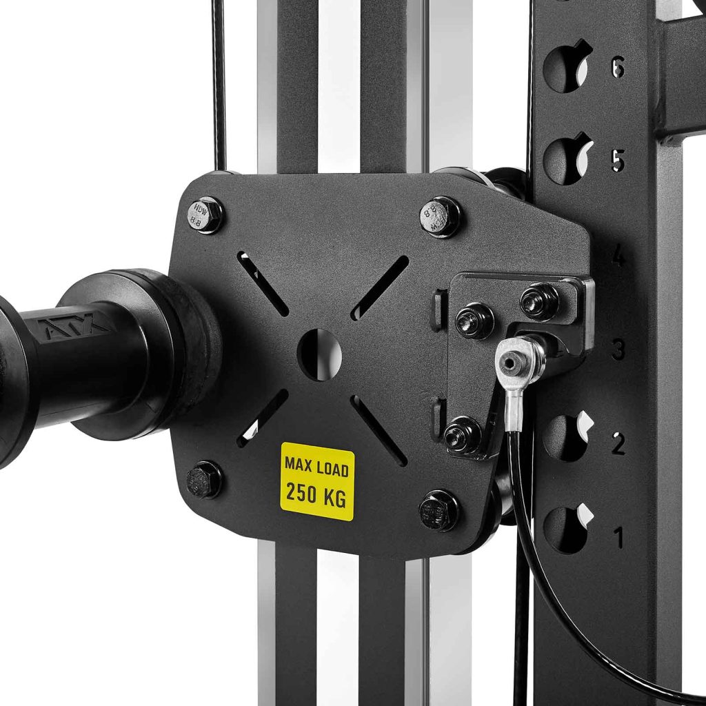 The ATX-BSM-760 Belt Squat Machine features a close-up view of its pulley system with a black metal plate bearing a yellow MAX LOAD 250 KG label. The plate is attached to vertical bars with adjustable holes and an integrated cable.