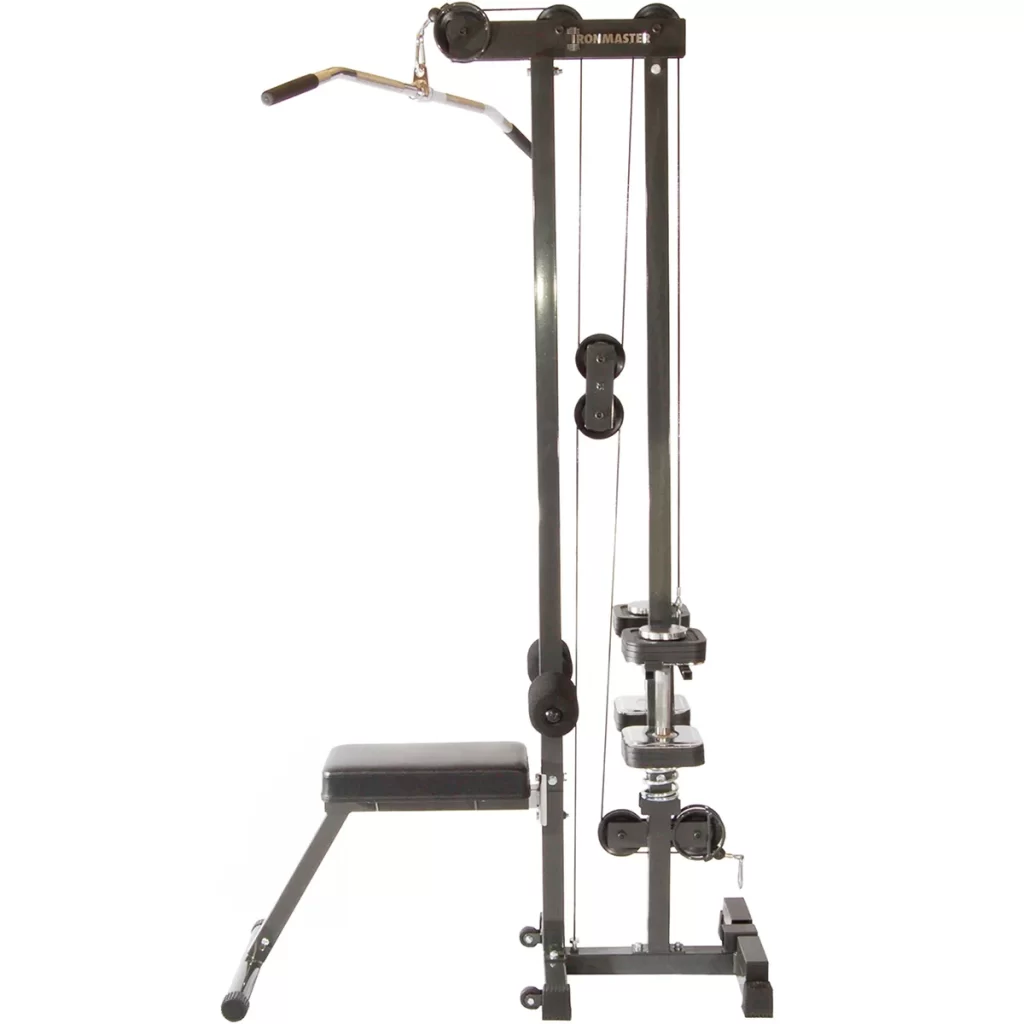 A compact home gym machine with a padded bench, pulley system, and a lat pulldown bar. The frame is metal with black accents, designed for upper body workouts. Wheels are attached at the bottom for mobility.