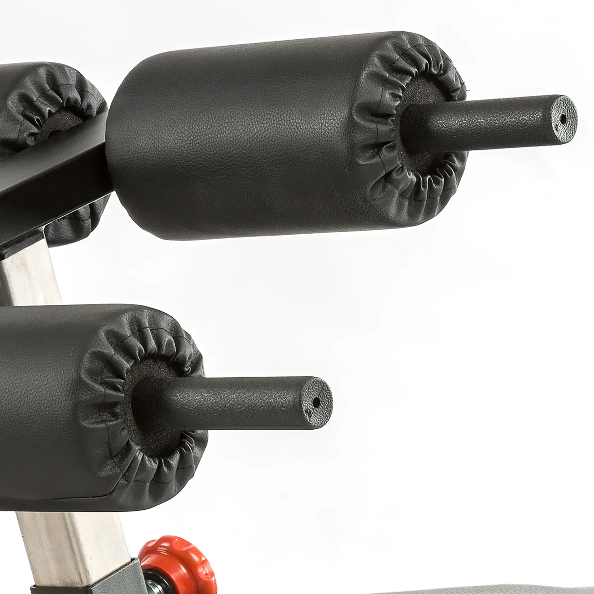 Close-up of black foam rollers on the ATX Torso Trainer, showing two padded cylindrical supports with handles against a white background.