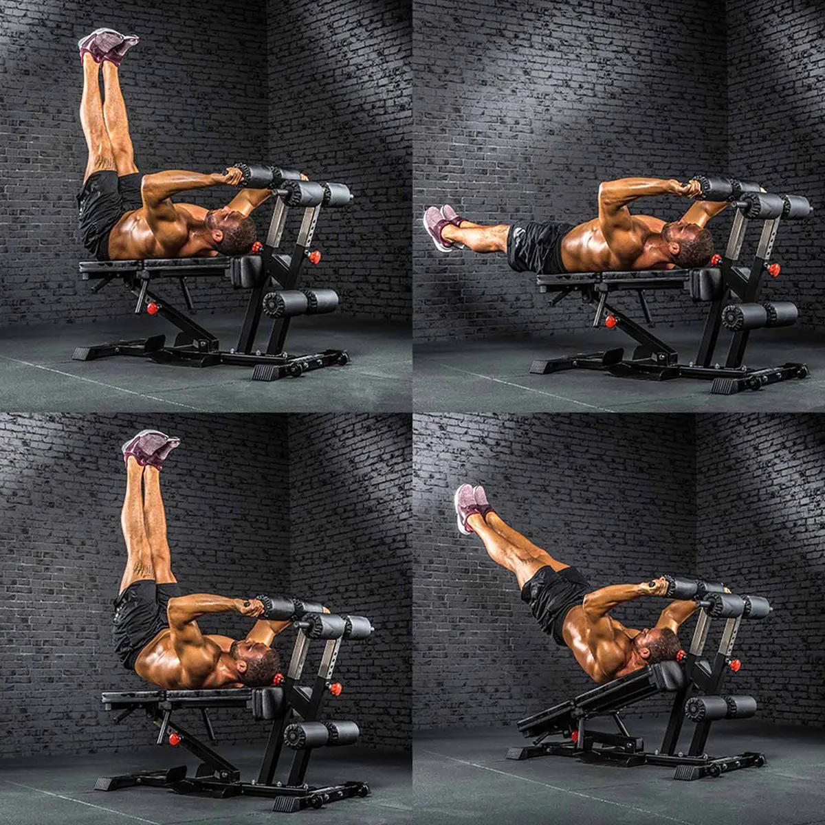 A muscular man demonstrates a hanging leg raise on the ATX Torso Trainer, gripping its handles and raising/lowering his legs in four stages, set in a gym against a dark brick wall background.